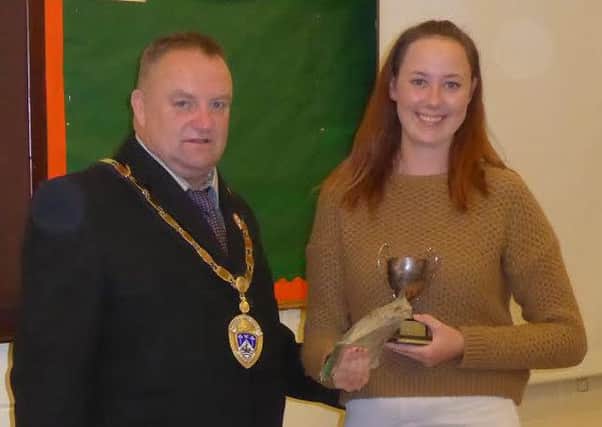 Elle Hunter receives the Russell Moore Memorial Trophy from Littlehampton mayor Ian Buckland
