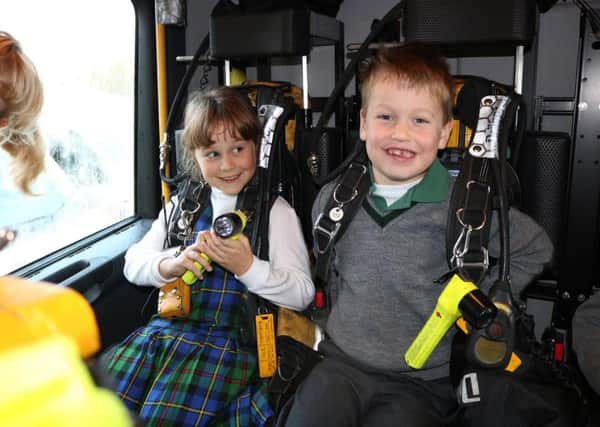 Maia Middleton (6) and Sam Hardie (6) ready for a call out in the fire engine