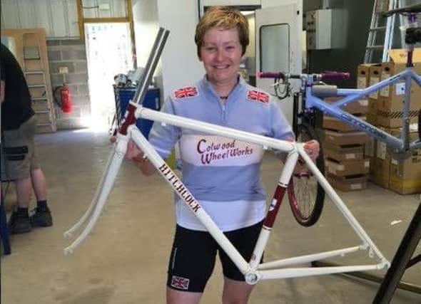Claire Hitchcock with the bike frame she made