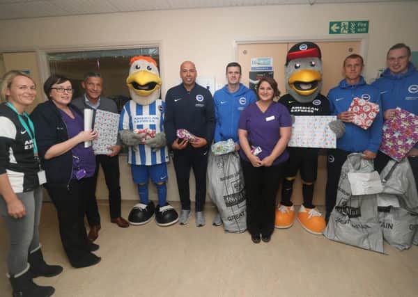 Brighton and Hove Albion players visited children at Worthing Hospital to give them Christmas presents. Pictures by Paul Hazlewood.