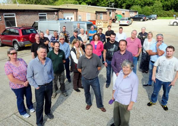 Business owners pictured last year on the industrial estate at Ebernoe, unable  to get broadband or mobile reception are still fighting for access