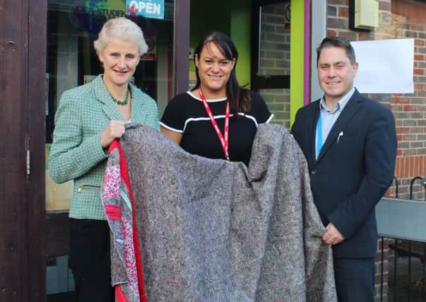 Shelagh Legrave, left, with Blanket Angels founder Anna Stephenson-Knight and Chichester College deputy principal Andrew Green with one of the blankets made during the day
