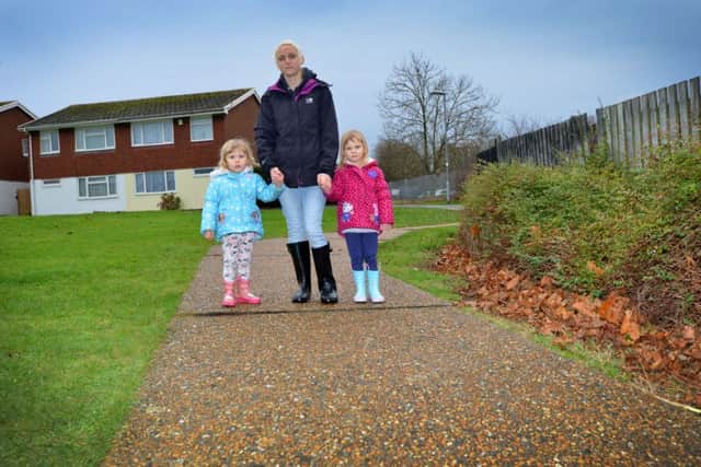 Nikki Spandley on the path with her children Skye and Aurora Weir.