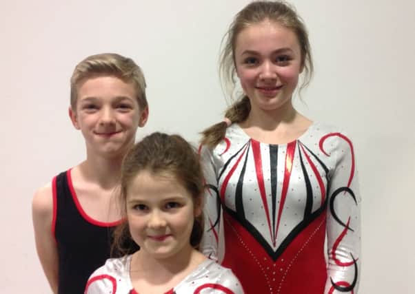 Three of the youngsters who performed with Dragonflyers
