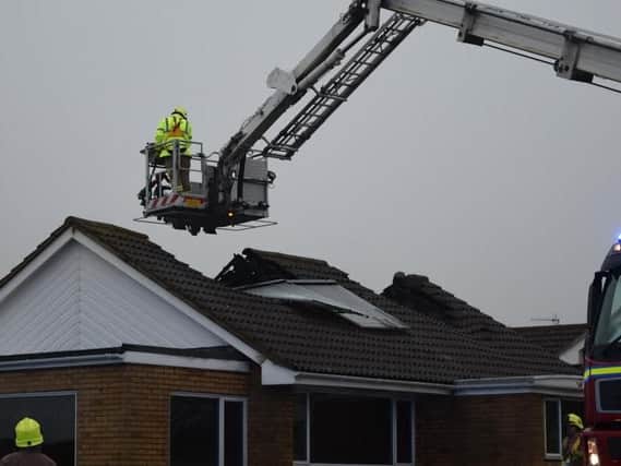 The bungalow's roof appears to have collapsed as a result of the fire. Photo by Dan Jessup