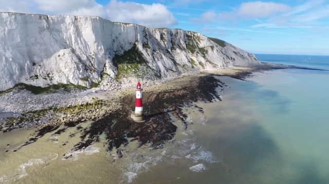 The low tide which allowed 900 people to walk around the Beachy Head lighthouse. Picture by Eddie Mitchell SUS-160407-105342001