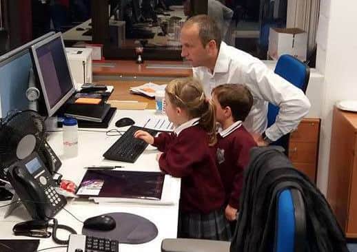 Schoolchildren Jack and Grace with Hastings Direct's David Walker. Photo courtesy of Hastings Direct SUS-161213-141611001