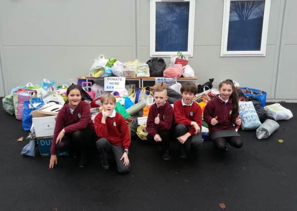 Pupils put together a collection for the homeless at Christmas SUS-161214-163352001