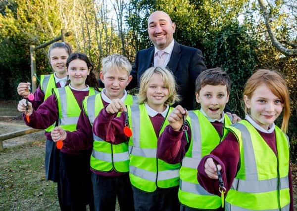 Turners Hill Primary head teacher Ben Turney with pupils (left to right) Beatie Brownings,Hermoine Jefferies,James Budgen,Brandon Wood, Max Pamplin and Chloe White ***Pic by David McHugh 07768 721637***