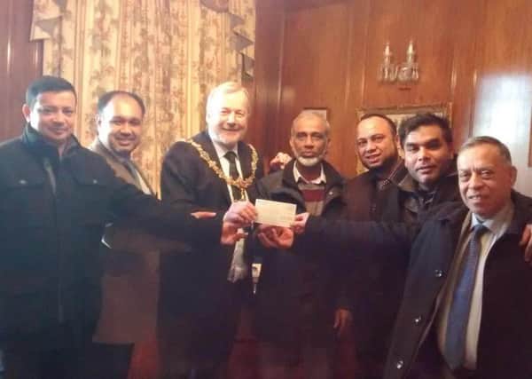 Sussex Bangladeshi Caterers Association members visit the Mayor's Parlour to hand over a cheque for Â£560