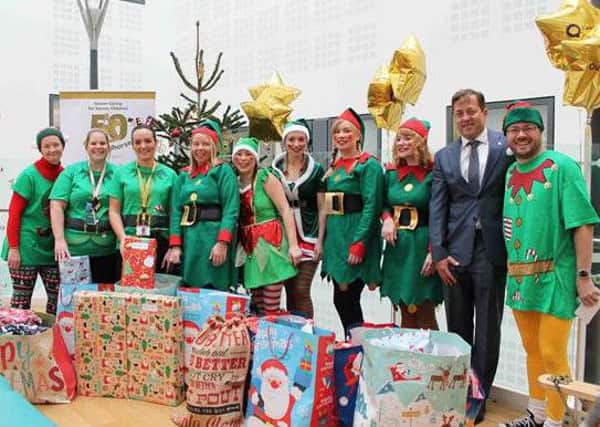 Staff from Austin Rees join members of Rockinghorse and the Play Team at the Royal Alexandra Childrens Hospital in Brighton for the charitys Dress Yourself as an Elf day. SUS-161214-145051001