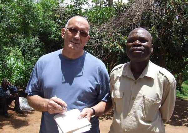 Geoff Howard with Pastor Lackson Dzungu village elder SUS-161214-121314001