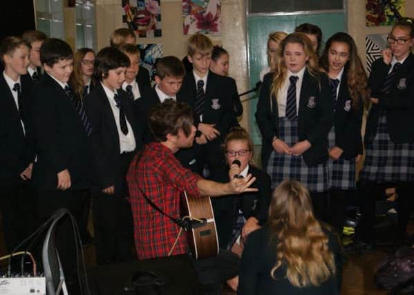 Eadie Swanton, holding the microphone, is a year 8 student who attended the workshop