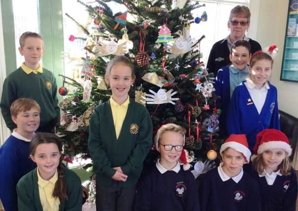 Pupils from all three Rustington schools have given Angmering Railway Station a festive makeover