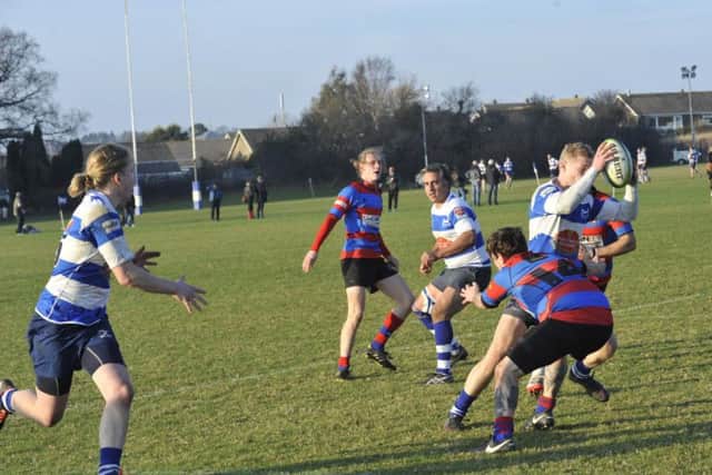 Chaz Ackerley is tackled with Harry Walker waiting for the offload. Picture by Simon Newstead