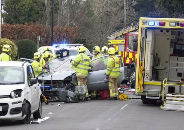 The woman became trapped in her car following the collision earlier today (December 20)