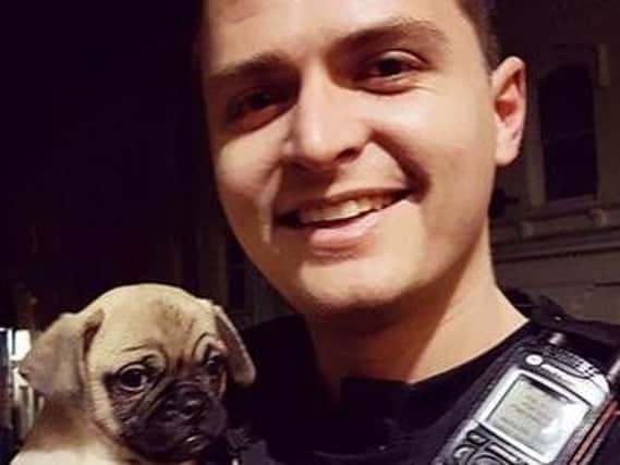 Gary the pug puppy with new owner PC Bradley Stadler