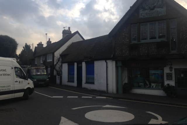 Shop damaged on 'most dangerous roundabout ever' at the junction of School Hill and Manleys Hill in Storrington