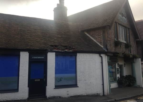 Shop damaged on 'most dangerous roundabout ever' at the junction of School Hill and Manleys Hill in Storrington