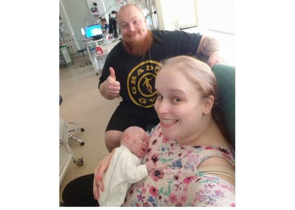 Dave Stone, 36, with his wife Sophie, 28, and their new baby son Alfie