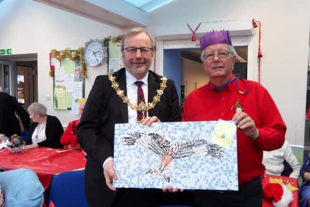 Worthing mayor Sean McDonald was delighted to win a mosaic kestrel, made by one of the vision-impaired members, and was presented with his raffle prize by chairman Barry Ward