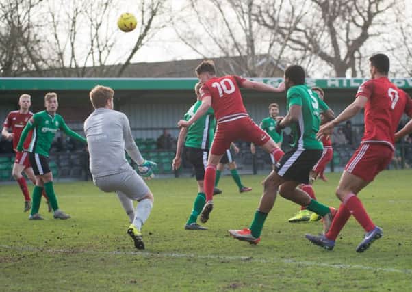 Ross Edwards heads home Worthing's winner at Burgess Hill. Picture by Marcus Hoare