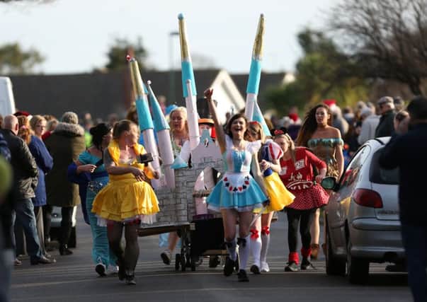 Fairytale princesses and friends help get a castle around the course. Pic: Tim Hale