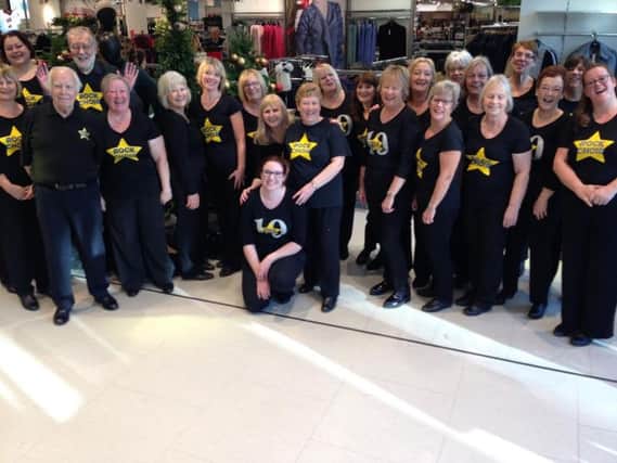 Battle and Hastings Rock Choir performed the flashmob in Hastings M&S SUS-161223-094752001