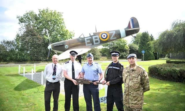 RAF High Wycombe representatives Dave Brown (left), Group Captain Phil Lester (centre) and Sergeant Ben Smart (right) with Sussex Police Neighbourhood Policing Sergeant Peter Allen (second left) and Heritage Crime Officer, PCSO Daryl Holter (second right) SUS-161223-121801001