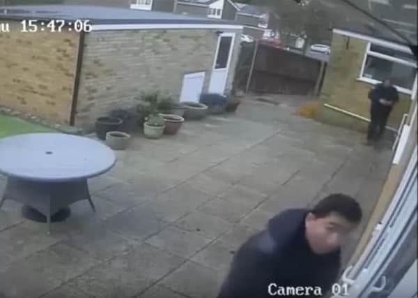 Police are looking for these men who were captured on CCTV at a property in Rackham Close, Crawley. Picture: Sussex Police SUS-161223-184145001