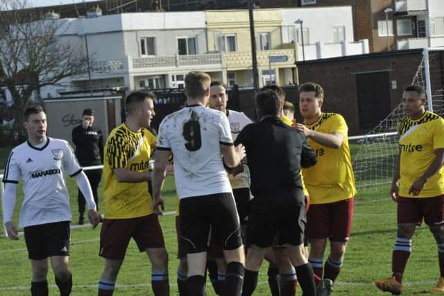 Things get a bit heated during the final moments at The Polegrove this morning. Picture by Simon Newstead
