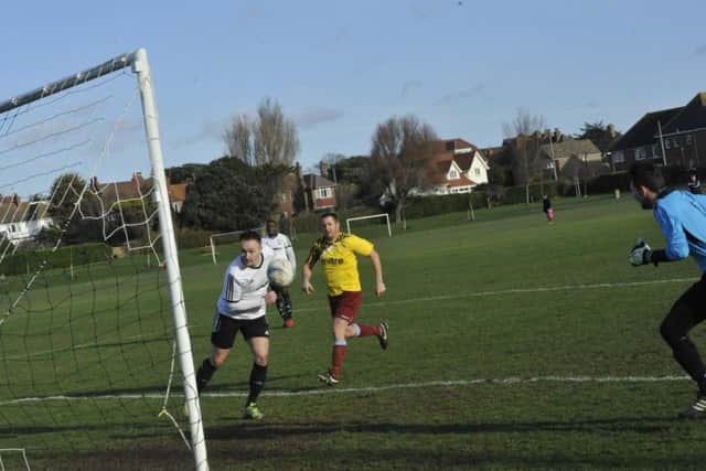 Gordon Cuddington gives Bexhill an early lead in the festive derby. Picture by Simon Newstead