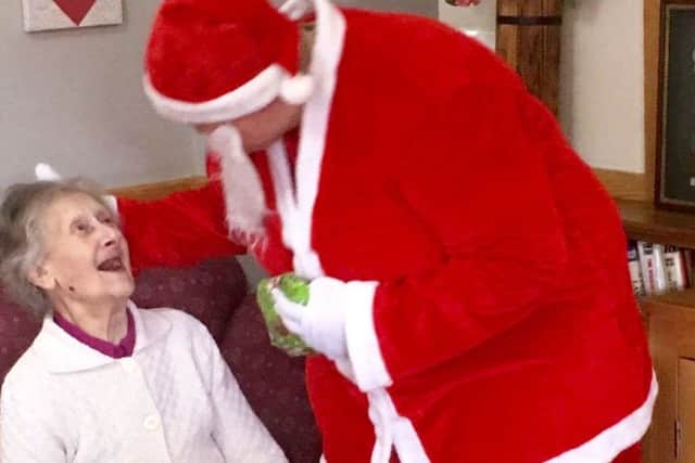 Santa pays a visit and delivers presents to residents