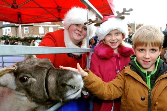 Clodagh and Paddy Fowler meet the reindeer. Picture: Steve Robards SR1637337