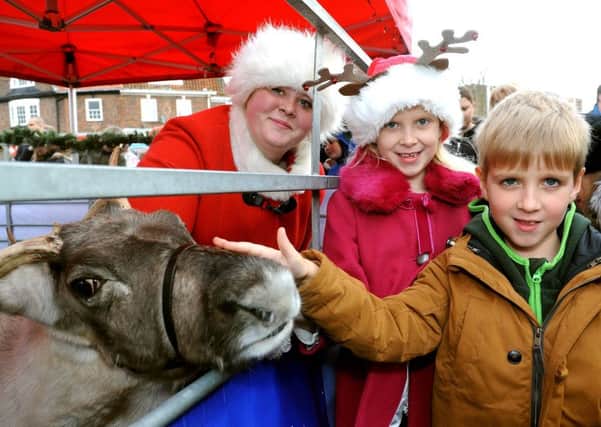 Clodagh and Paddy Fowler meet the reindeer. Picture: Steve Robards SR1637337