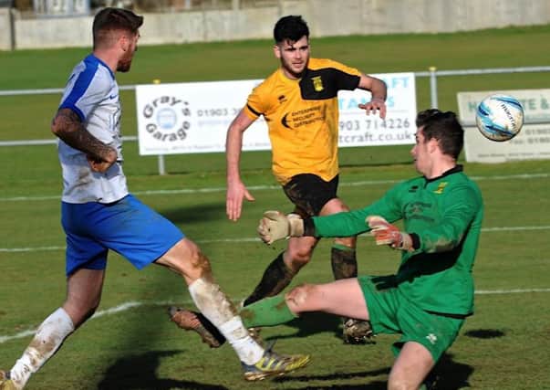 Rob O'Toole scores Shoreham's goal in their defeat at Littlehampton on Monday. Picture by Stephen Goodger