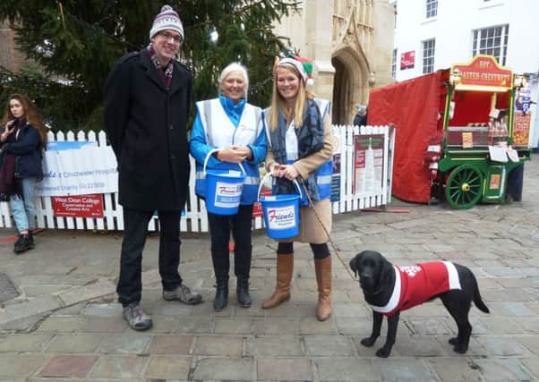 The collection at The Cross in Chichester was supported by a canine 'friend'