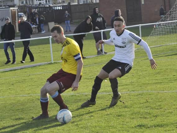 Action from the Boxing Day derby between Bexhill United and Little Common. Picture by Simon Newstead