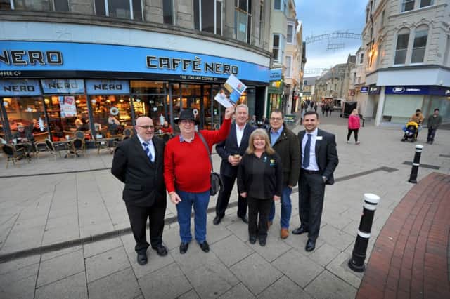 Town centre manager Rob Woods (centre) pictured with the Hastings BID steering group in Hastings town centre.