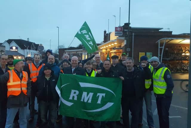 Members of the RMT union outside Horsham Railway Station (photo by the RMT). SUS-160812-091909001