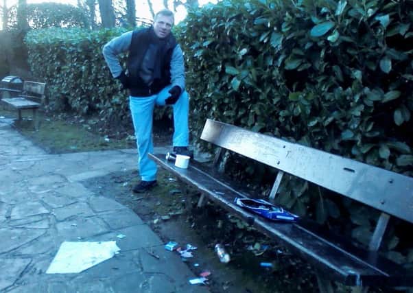 Chris Lever with litter in Horsham's Memorial Peace Garden SUS-161230-142301001