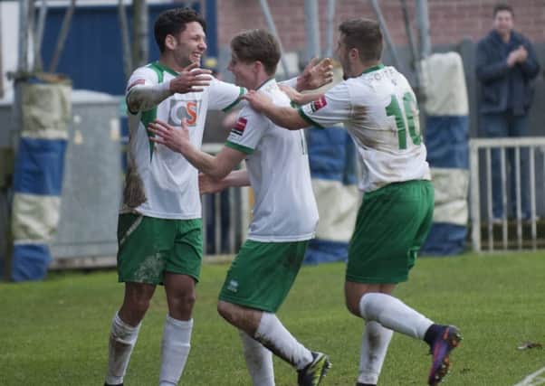 Alex Parsons, Oscar Haynes-Brown and Ollie Pearce celebrate the late, late winner at Imber Court / Picture by Tommy McMillan