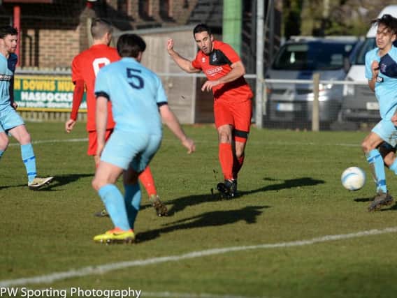 Phil Gault scores against AFC Uckfield. Picture by PW Sporting Photography