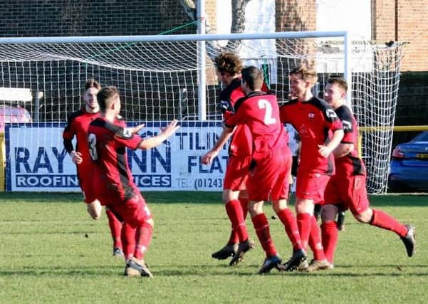Wick players celebrate after Andy Chick's leveller on Monday. Picture by Roger Smith