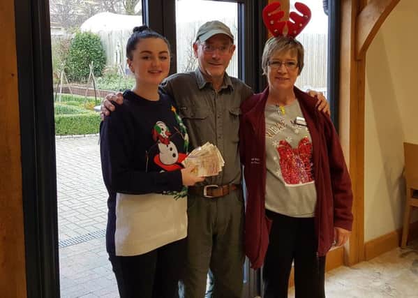 Staff from The Barn Coffee Shop and Restaurant at South Downs Nurseries in Hassocks have donated their Christmas tips of Â£225 to The Budding Foundation. Restaurant Manager, Karin Reinger and Rosie Tate with Clive Gravett from The Budding Foundation - picture submitted by Tates
