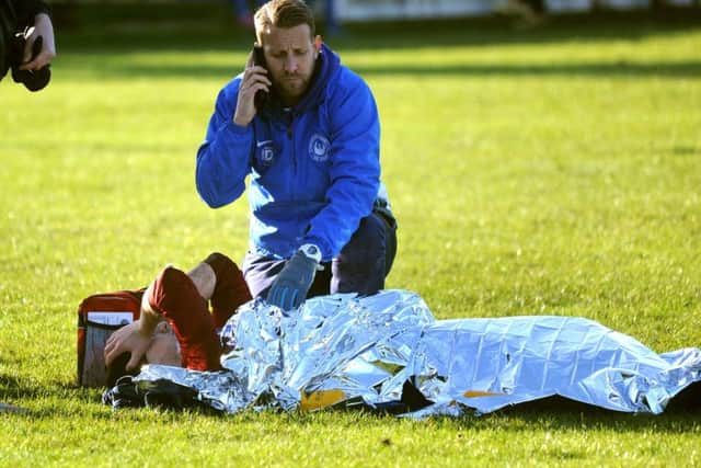 Storrington player Greg Clark in agony after suffering a double leg break playing against Selsey. Pic Steve Robards  SR1637633 SUS-170201-153111001