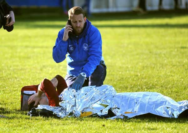 Storrington player Greg Clark in agony after suffering a double leg break playing against Selsey. Pic Steve Robards  SR1637633 SUS-170201-153111001