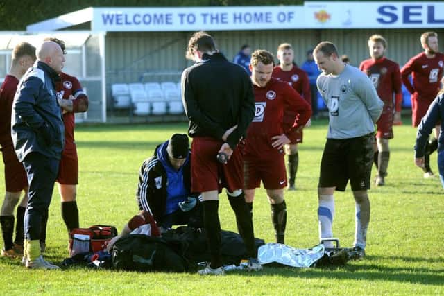 The player was treated by club staff but had to wait nearly two hours in the cold for paramedics to arrive. Picture by Steve Robards