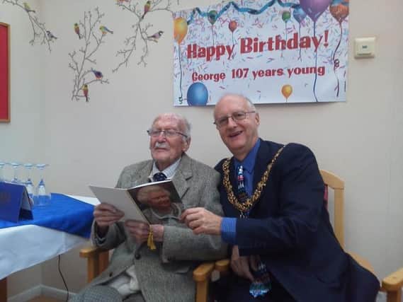 George Korner celebrates his 107th birthday with the mayor of Lewes SUS-170401-094036001