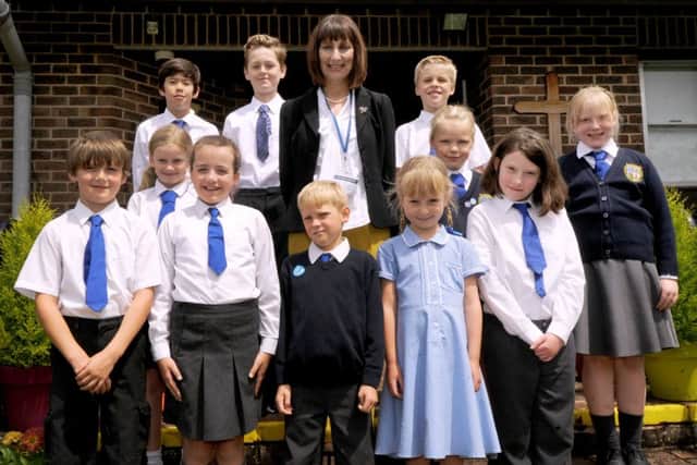 Marian Ham pictured with pupils at Sedlescombe Church of England Primary School. SUS-160630-135847001